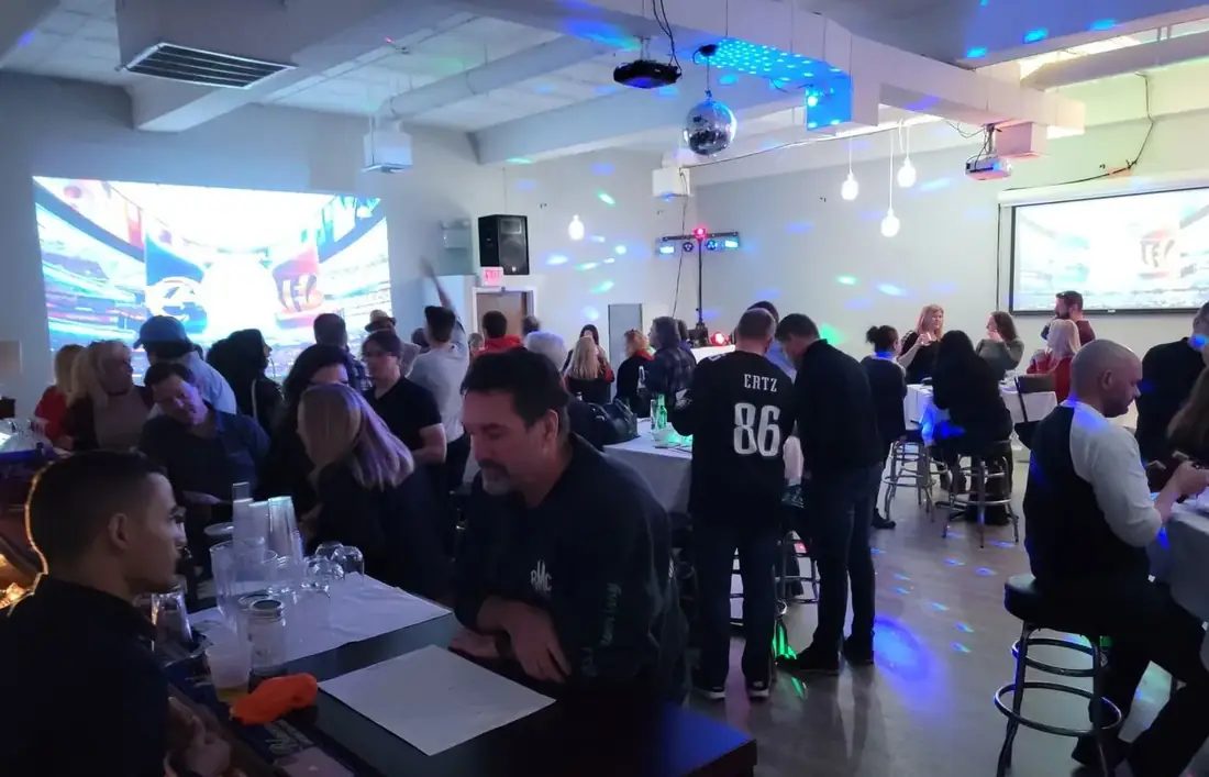 A watch party in The Loft at 660 with football on two projection screens, a crowd at high tables and its own bar.